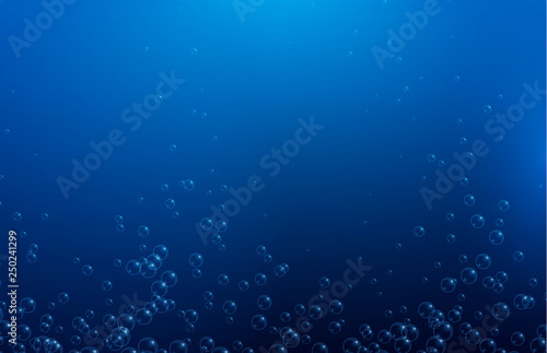 Blue water background with realistic bubbles or drops. © svetlaborovko