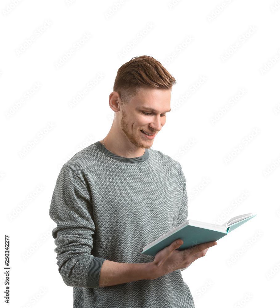 Handsome young man with book on white background Handsome young man with book on white background