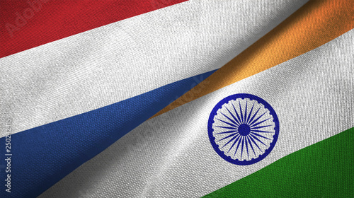 Netherlands and India two flags textile cloth, fabric texture photo