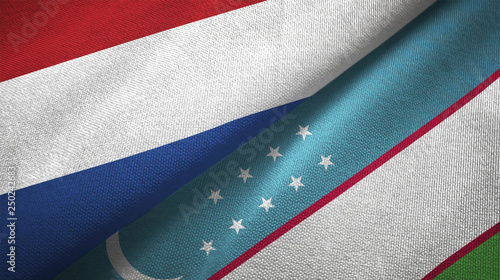 Netherlands and Uzbekistan two flags textile cloth, fabric texture