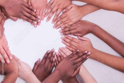 multi national skin colour hands in a heart shape