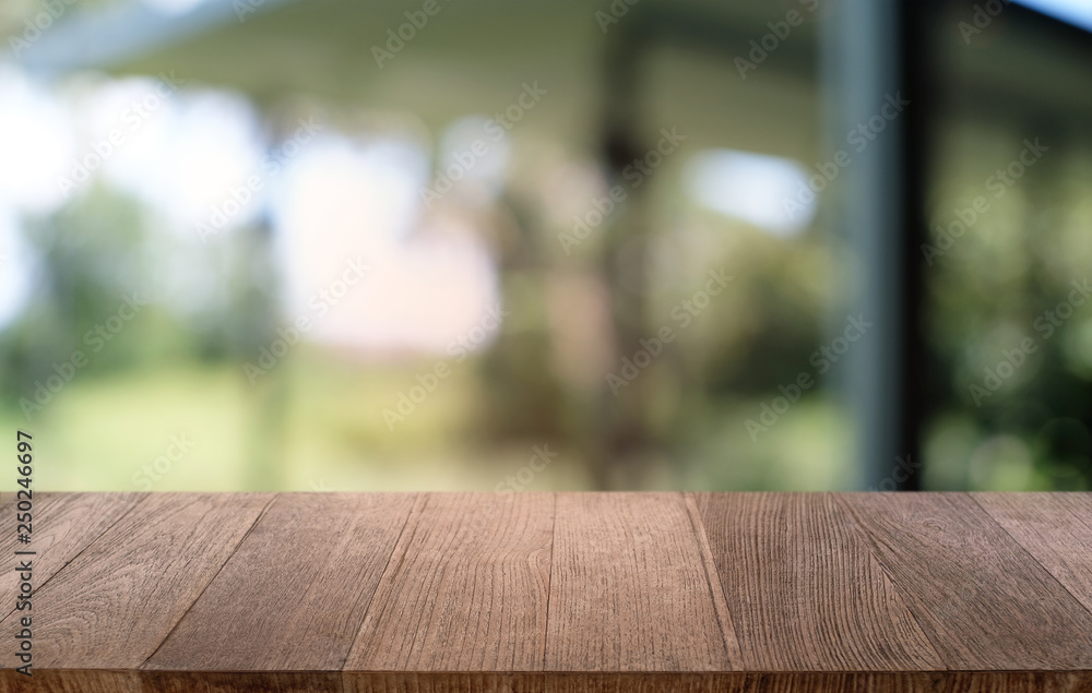 Empty dark wooden table in front of abstract blurred bokeh background of restaurant . can be used for display or montage your products.Mock up for space. Empty dark wooden table in front of abstract blurred bokeh background of restaurant . can be used for display or montage your products.Mock up for space.