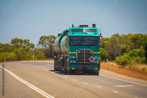 Big Road Train in the Australian Outback with trailer bringing fuel to gas station