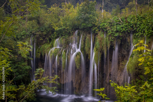 The beautiful and stunning Plitvice Lake National Park  Croatia  wide shot of a waterfall