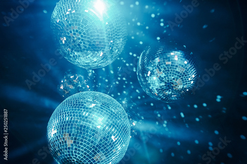 classic blue shining disco balls. disco atmosphere concept. color of the year 2020 photo