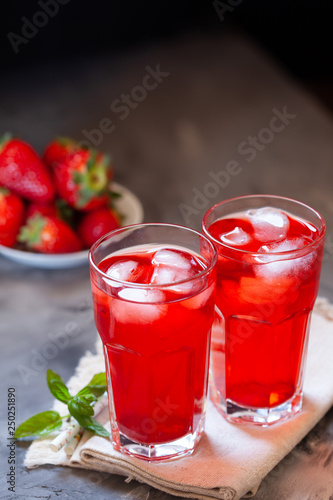 Fresh strawberry lemonade garnished with mint, copy space