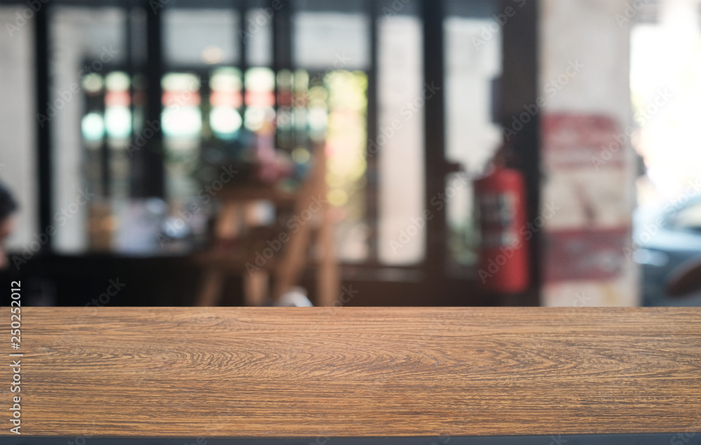 Empty dark wooden table in front of abstract blurred bokeh background of restaurant . can be used for display or montage your products.Mock up for space. Empty dark wooden table in front of abstract blurred bokeh background of restaurant . can be used for display or montage your products.Mock up for space.
