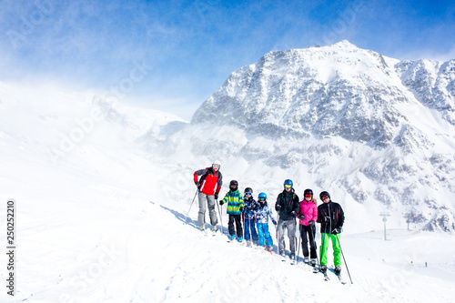 Happy people, children and adults, skiing on a sunny day in Tyrol mountains © Tomsickova
