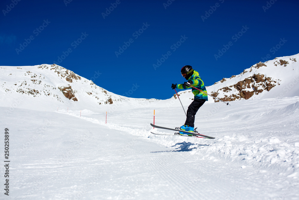 Happy people, children and adults, skiing on a sunny day in Tyrol mountains