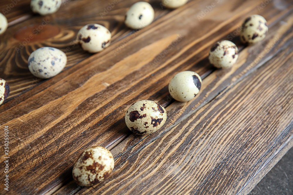 Fresh quail eggs on wooden table Fresh quail eggs on wooden table