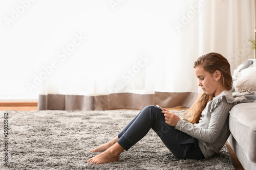 Cute little girl with table...
