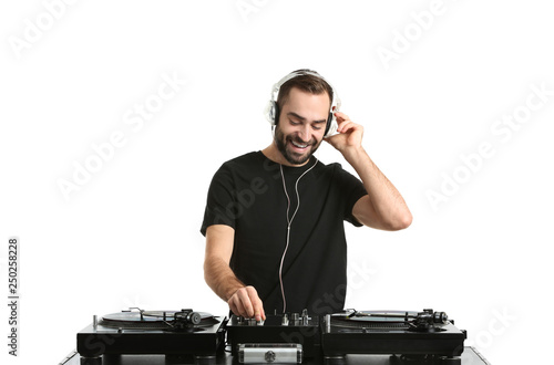 Male DJ playing music on white background photo