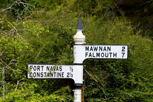 Old cast iron road sign between Constantine and Falmouth, Cornwall, England, United Kingdom, Europe photo