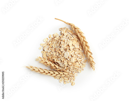 Photography Heap of raw oatmeal on white background