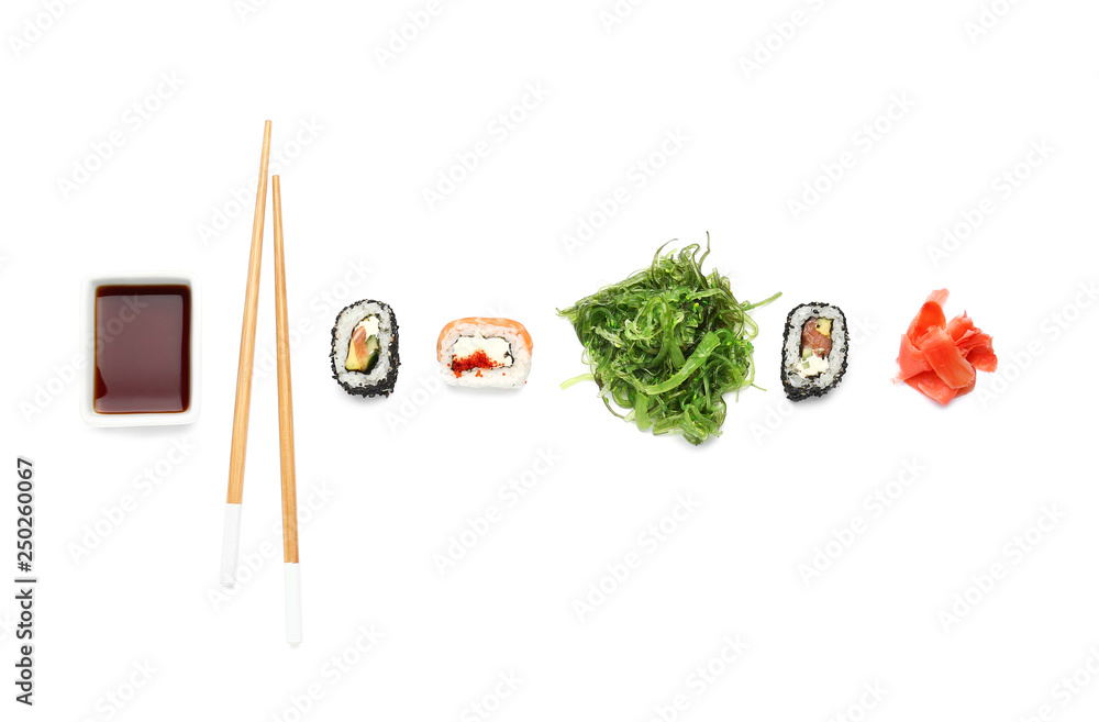 Composition with tasty sushi rolls on white background Composition with tasty sushi rolls on white background