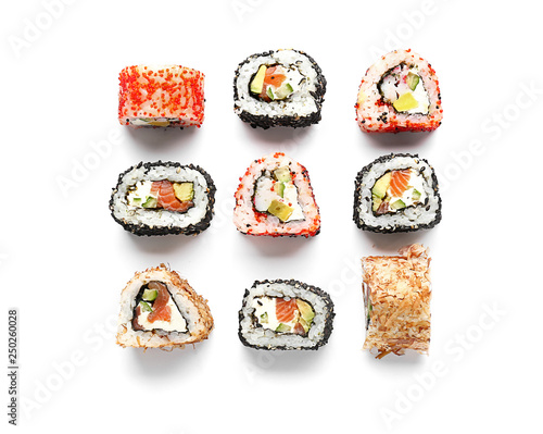 Tasty sushi rolls on white background photo