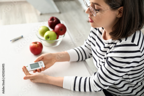 Diabetic woman measuring bl...