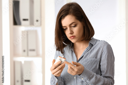 Diabetic woman measuring su...