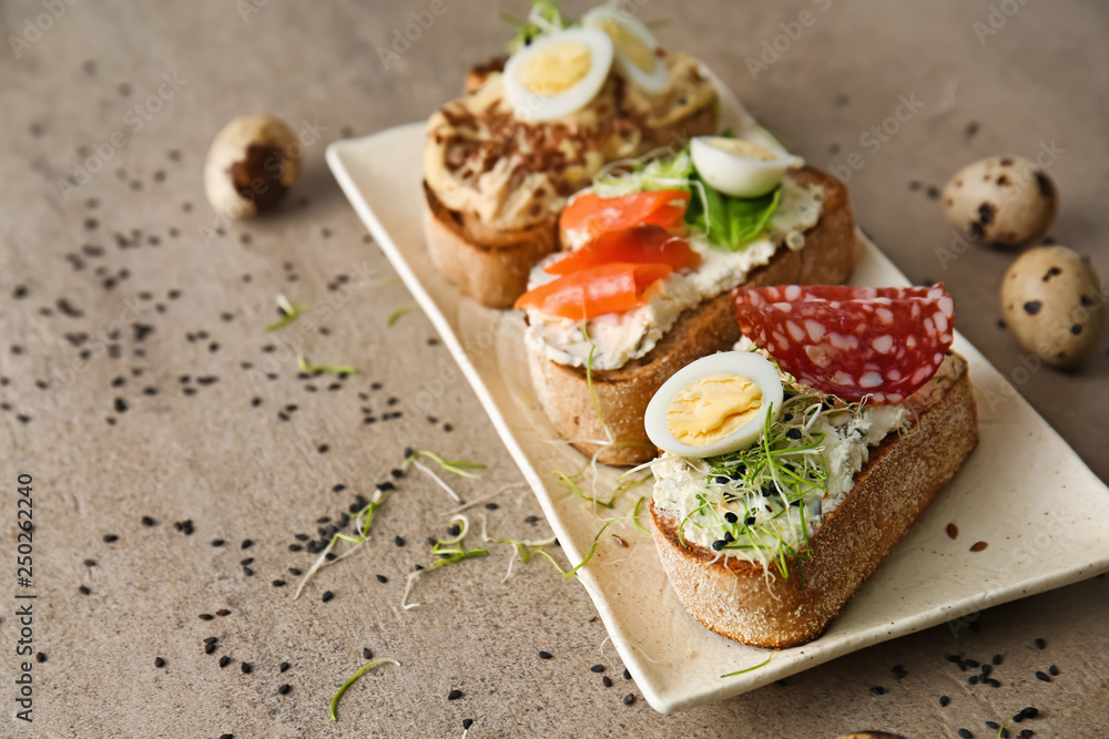 Plate with fresh tasty bruschettas on table Plate with fresh tasty bruschettas on table