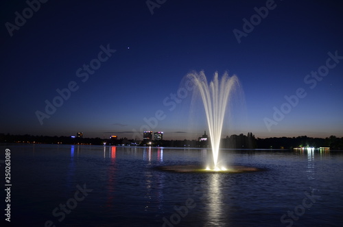 View of the fountain in Herastrau Park in Bucharest at night