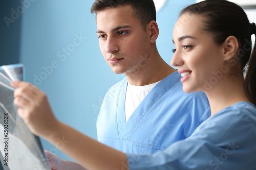 Young doctors studying MRI ...