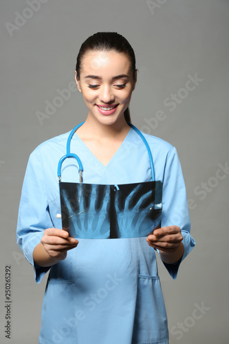 Female doctor studying X-ra...