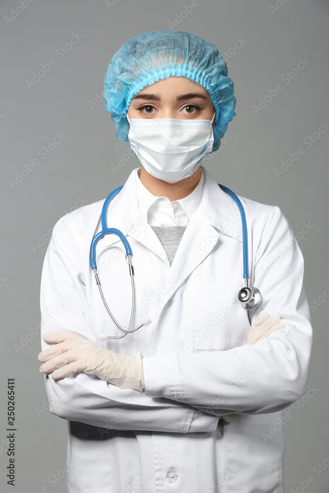 Female doctor on grey background Female doctor on grey background