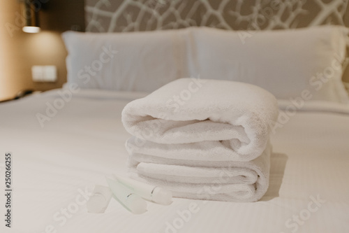white towel decoration on bed in bed room interior © Fototocam