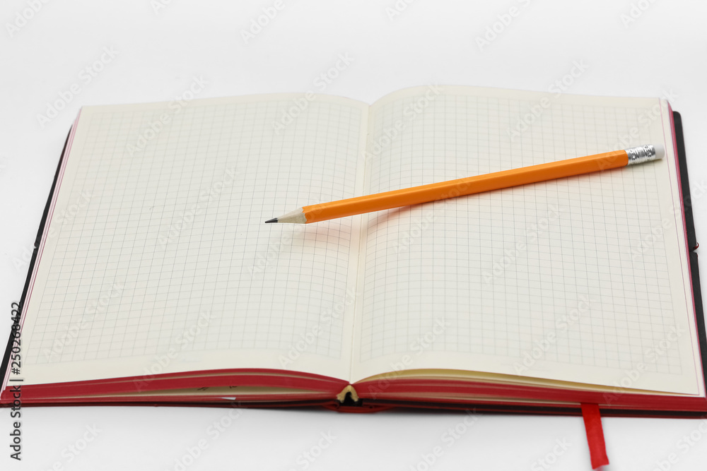 Business concept. Top view collection of notebook, white open flip curl rolled page and pencil on background for mockup Business concept. Top view collection of notebook, white open flip curl rolled page and pencil on background for mockup