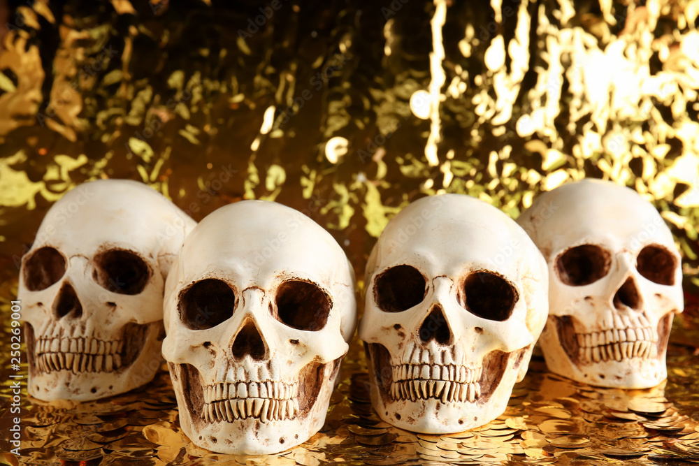Human skulls on golden background Human skulls on golden background
