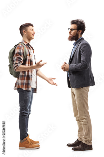 Teenage male student talking to his father