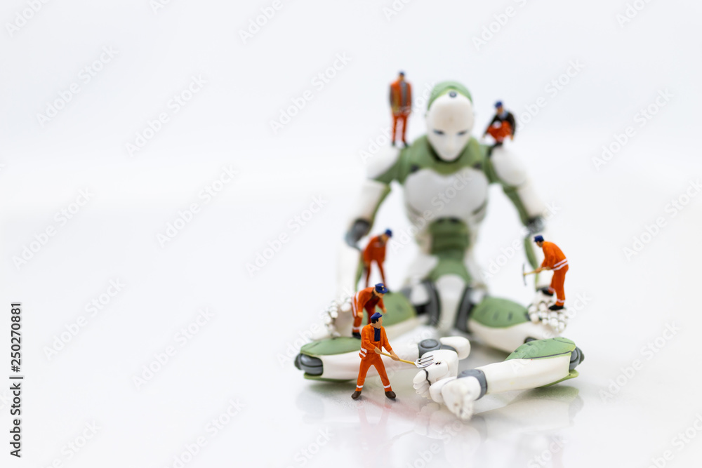 Fototapeta premium Miniature people : Engineering is developing an AI robot system, using labor instead of people. Image use for new technology in the feature, business concept.