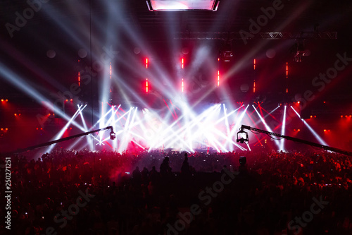 Stage illuminated by beautiful rays of lighting equipment.