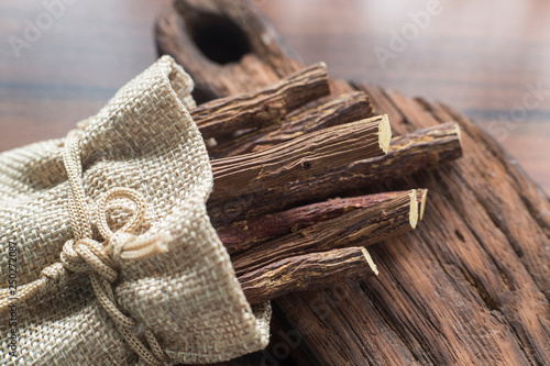 Photos licorice root on the table - Glycyrrhiza glabra