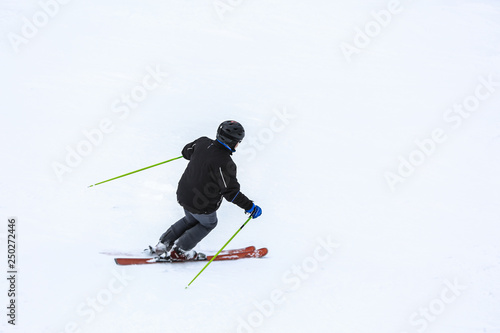 Sporty skier at winter resort