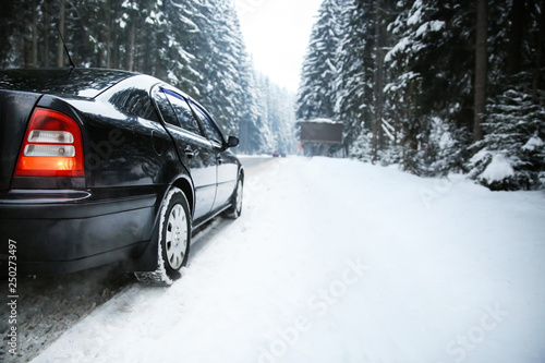 Car on road at snowy winter resort