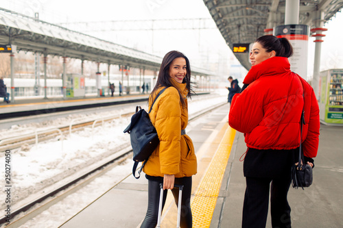 Young females take  the train.