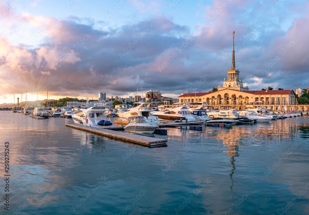 Naklejka premium Sochi Marine Station and the yacht pier at sunset.