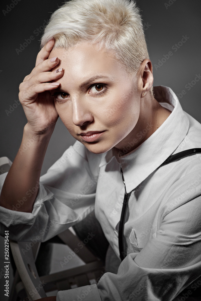 Beautiful girl in a shirt with short hair. Beautiful girl in a shirt with short hair.