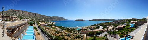 Panorama of swimming pools at luxury hotel with a view on Spinalonga Island, Crete, Greece