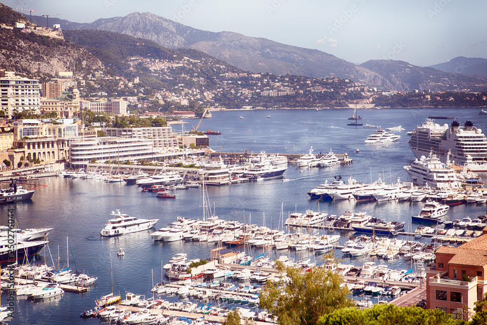 View of the Principality of Monaco and port with sailing and fishing boats
