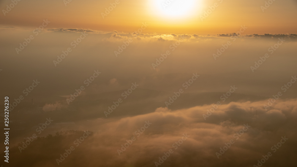 Sunrise above the clouds from hot air balloon Sunrise above the clouds from hot air balloon