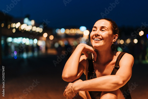 Pretty pan asian girl relaxing outdoor in the evening time.