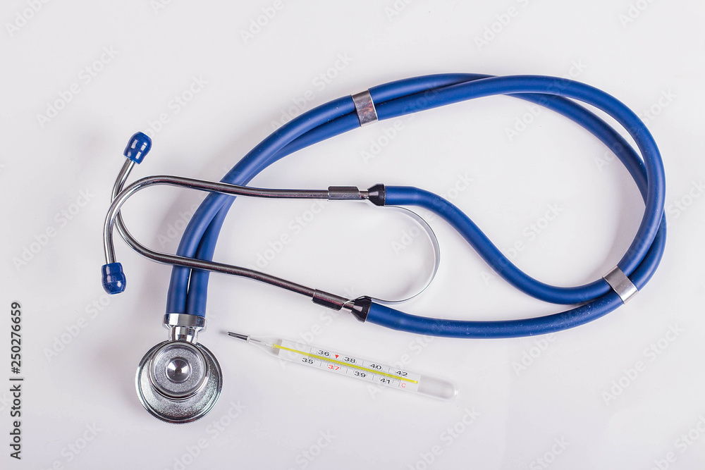 Stethoscope or phonendoscope, thermometer, medical device for auscultation, medical equipment on a white background. Stethoscope or phonendoscope, thermometer, medical device for auscultation, medical equipment on a white background.