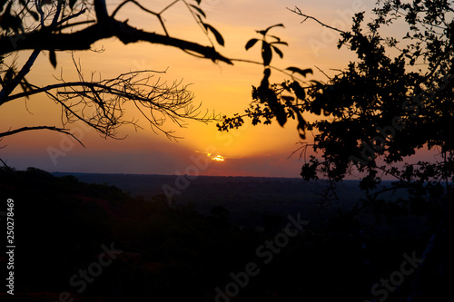 A view of the sunset over the Marafa canyon in Kenya, Africa. Landscape and safari under evening sky.