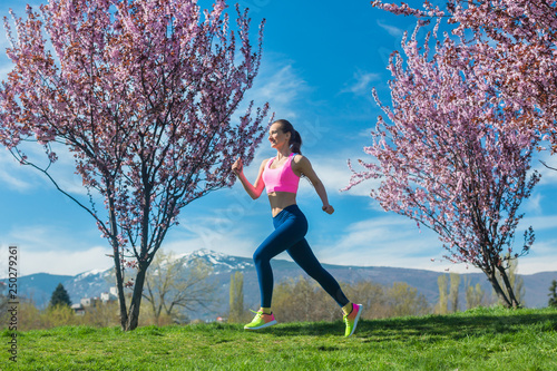 Woman running for fitness on a spring day