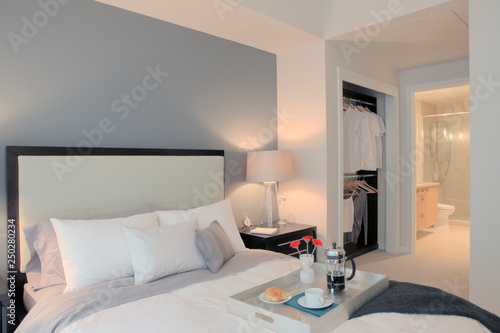 Breakfast on tray in luxury master bedroom