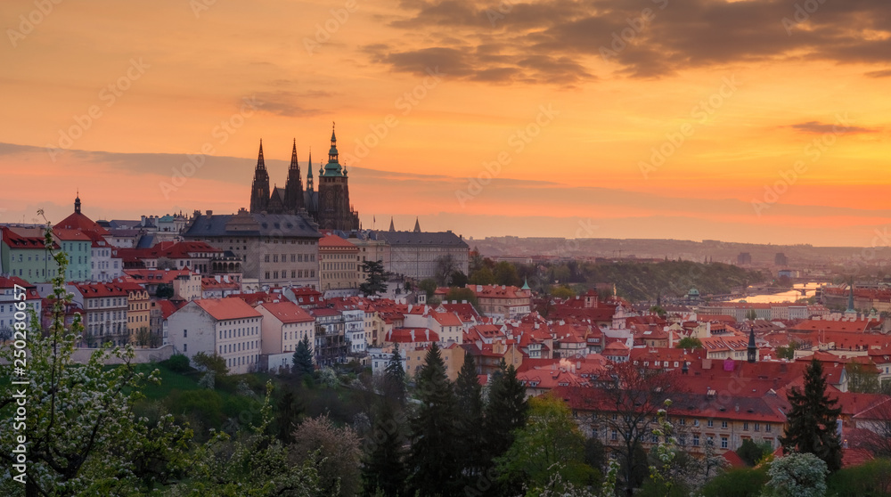 A beautiful spring view of Prague at sunrise from Petrin hill. Prague Castle and St. Vitus Cathedral on the left side.