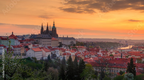A beautiful spring view of Prague at sunrise from Petrin hill. Prague Castle and St. Vitus Cathedral on the left side. © Kennymax