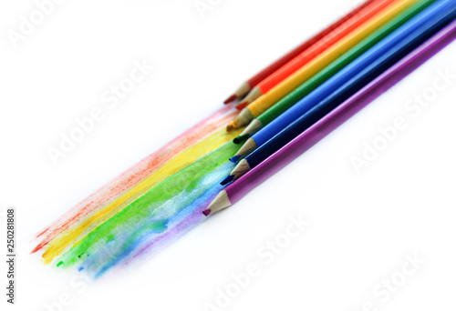 Colored watercolor pencils paint a rainbow. Creation